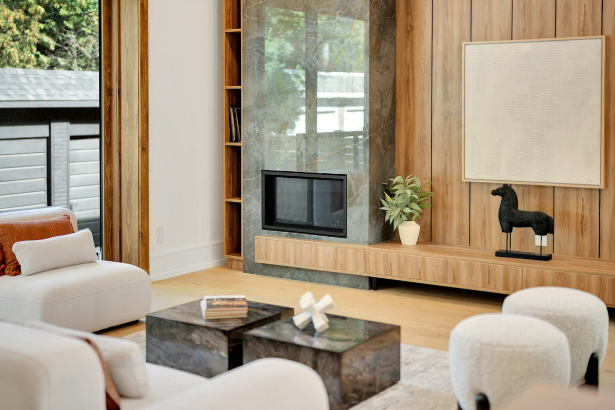 Minimal living room with a panelled fireplace wall and no visible cables